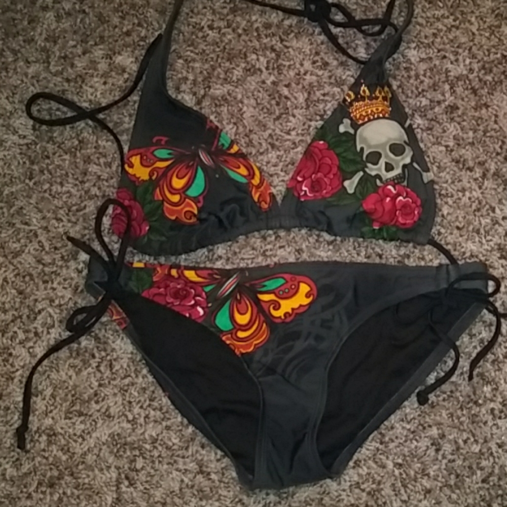 Swim suit w/roses,butterflies,and skull.